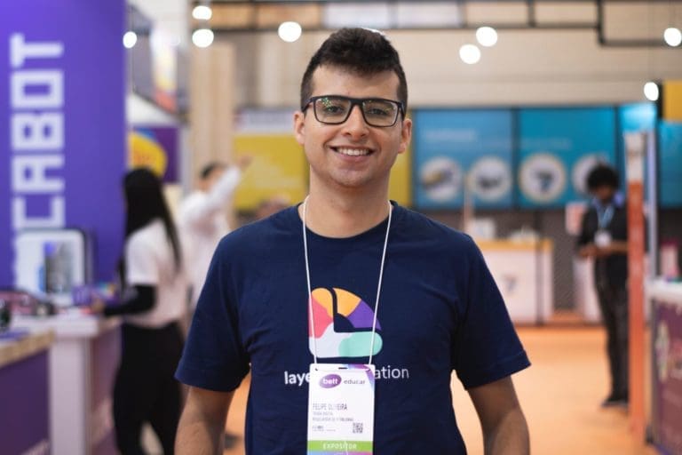 Man smiling at a tradeshow booth.